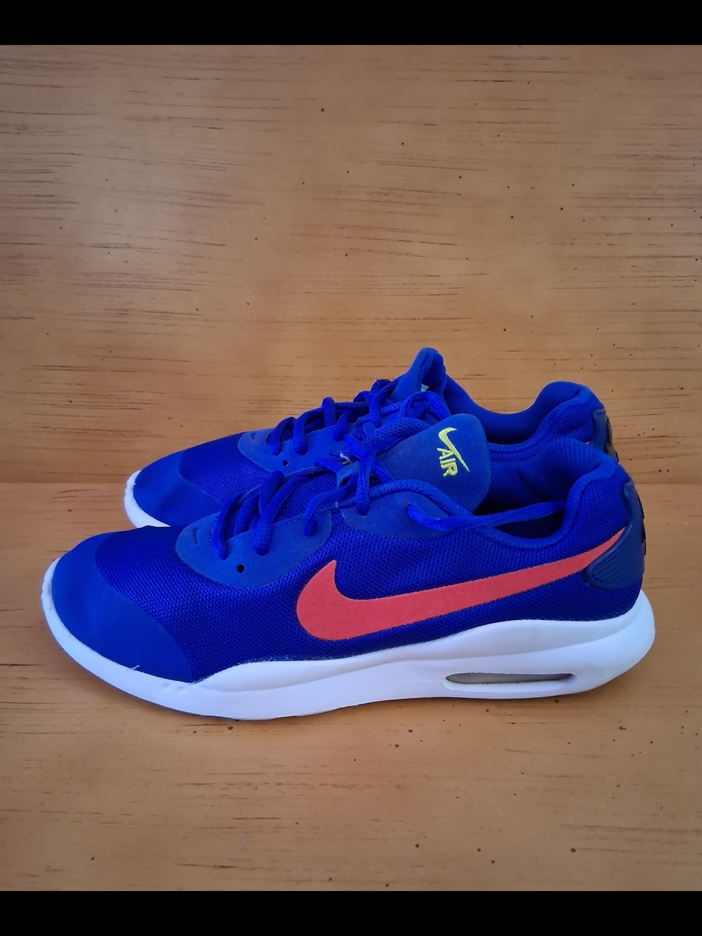 Nike Blue Athletic Sneakers with Orange Swoosh